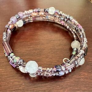 Handmade beaded memory bracelet. Cuff style in shades of purple and mauve